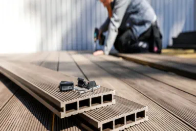 new decking with handyman working in background